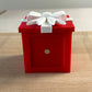 Side of the red Keepsake Box showing the built-in magnet