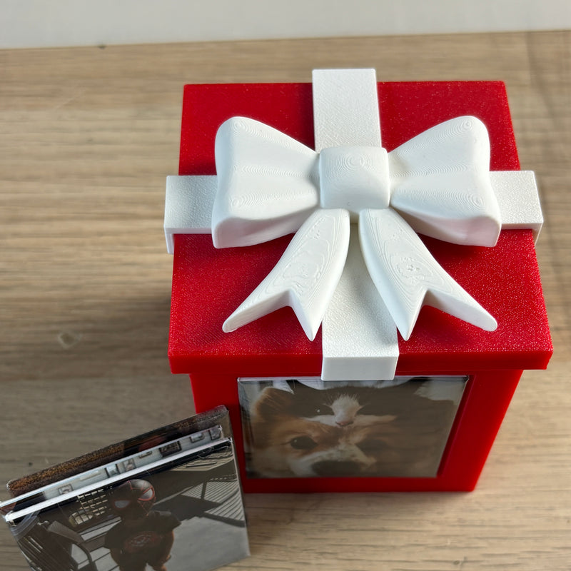 Red Keepsake Box next to a stack of photo magnets