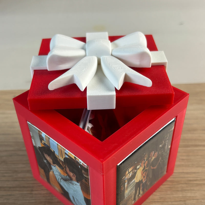 Red Keepsake Box with the lid lifted and photo magnets on the sides